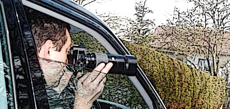 un detective prive prend une photo discrete